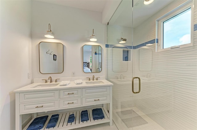 bathroom featuring vanity and a shower with door