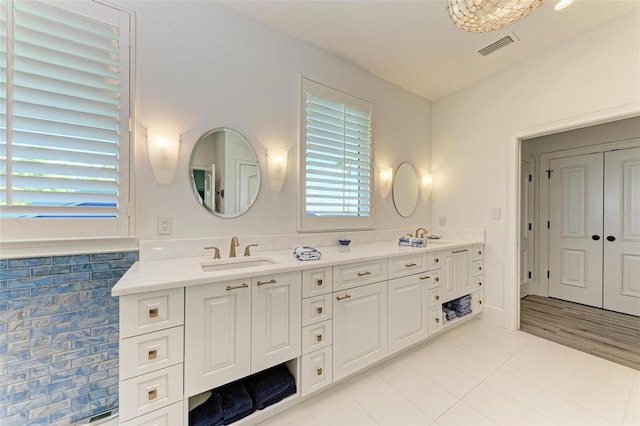 bathroom with tile patterned flooring and vanity