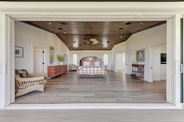 bedroom featuring wooden ceiling, vaulted ceiling, and hardwood / wood-style flooring