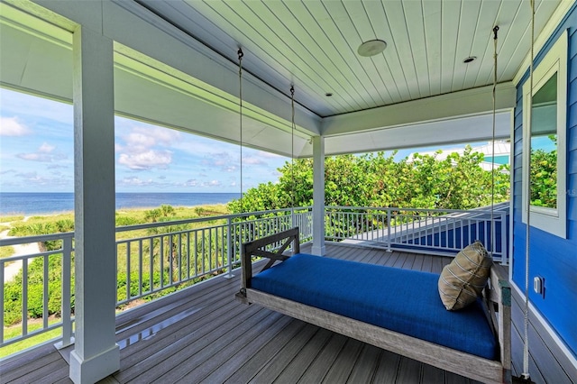 wooden terrace with a water view