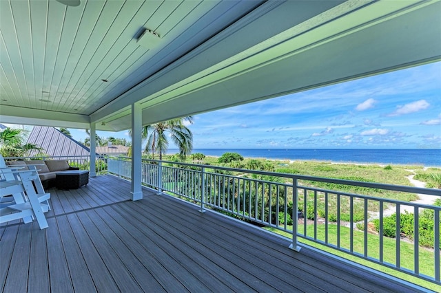 wooden terrace with outdoor lounge area and a water view