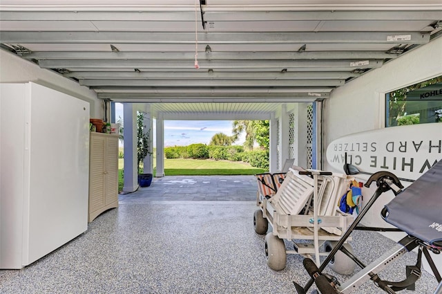 garage featuring white fridge