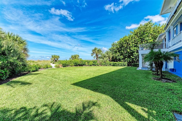 506 S Casey Key Rd, Nokomis, FL 34275 - view of grassy yard with a balcony