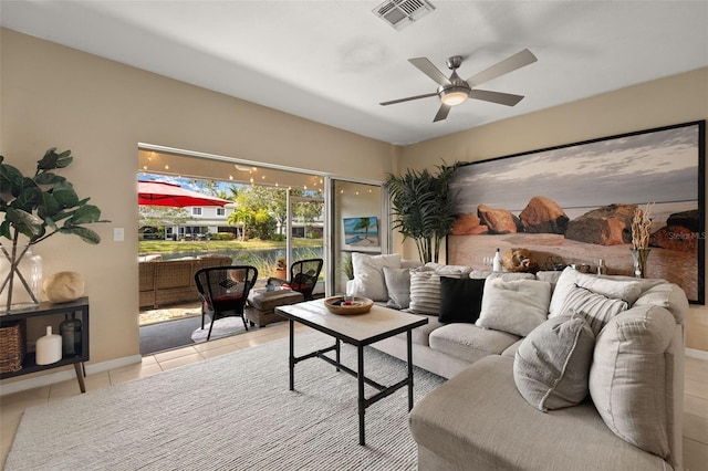 living room featuring ceiling fan and light tile patterned flooring