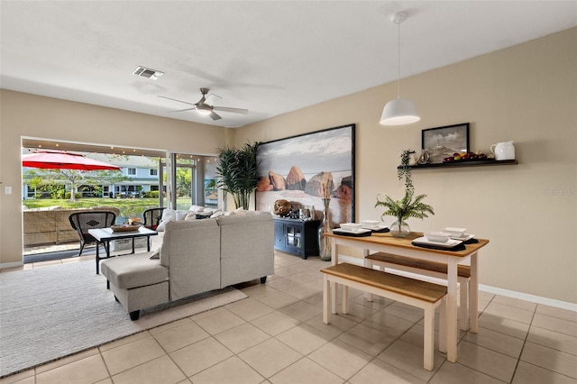 living room featuring ceiling fan and light tile patterned flooring