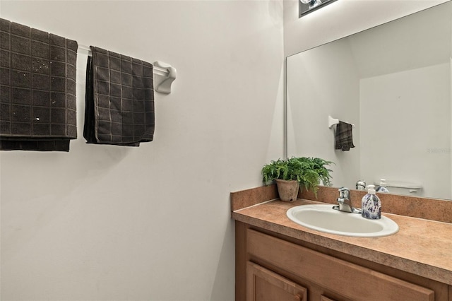 bathroom with toilet and vanity