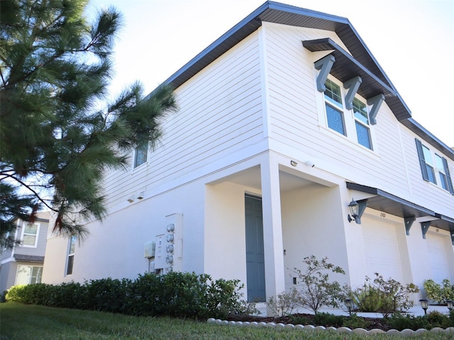 view of property exterior with a garage