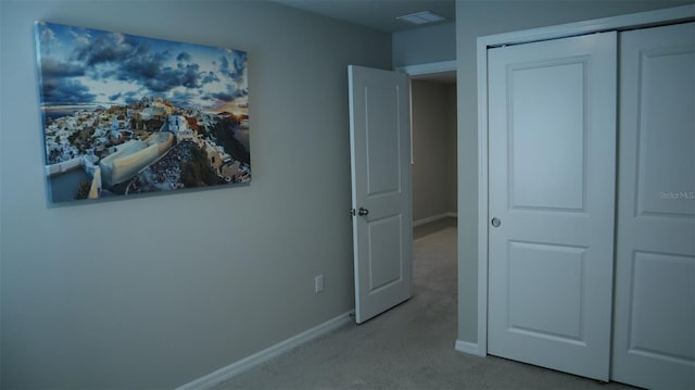 carpeted bedroom featuring a closet