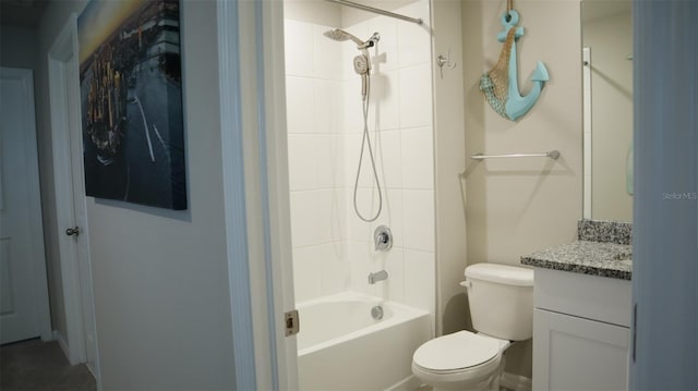 full bathroom featuring vanity, toilet, and tiled shower / bath