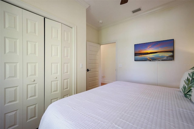 bedroom with ceiling fan and crown molding