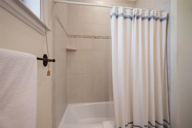 bathroom featuring shower / bath combination with curtain