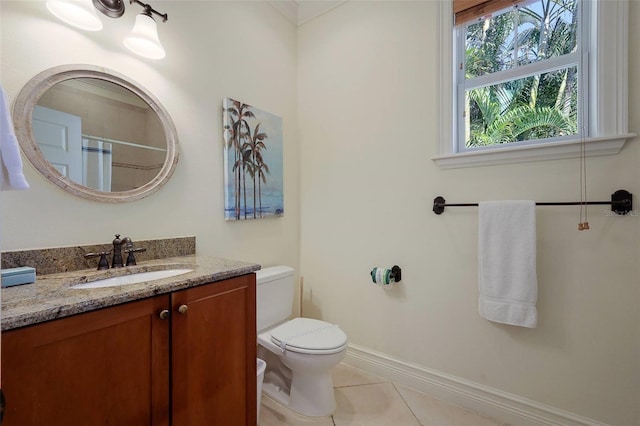 bathroom featuring toilet, vanity, and tile patterned floors