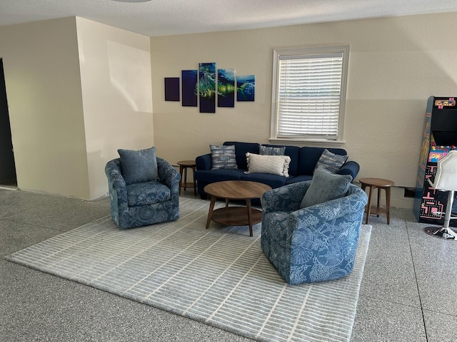 living room with a textured ceiling