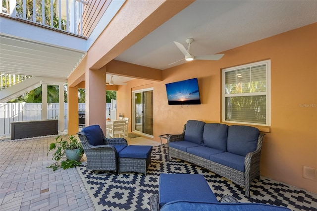 view of patio featuring an outdoor hangout area and ceiling fan