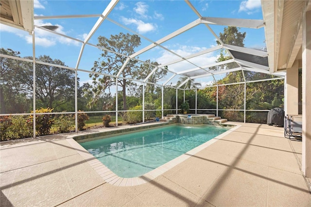 view of swimming pool featuring a patio and glass enclosure