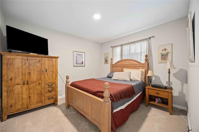 bedroom with light colored carpet