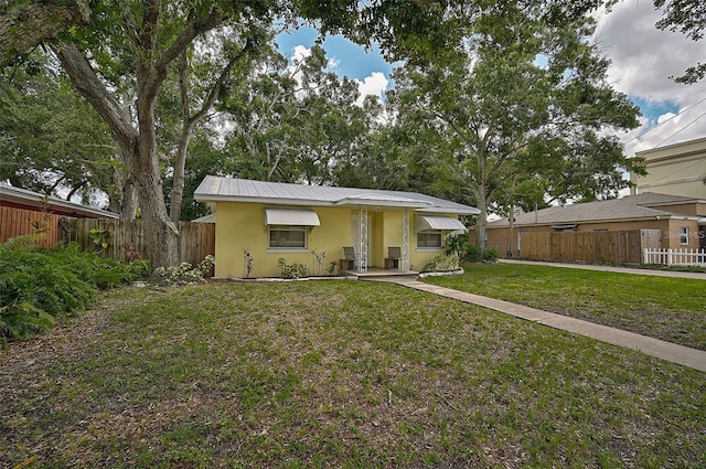 view of front of house with a front lawn