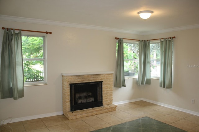 unfurnished living room featuring ornamental molding, light tile patterned floors, and plenty of natural light