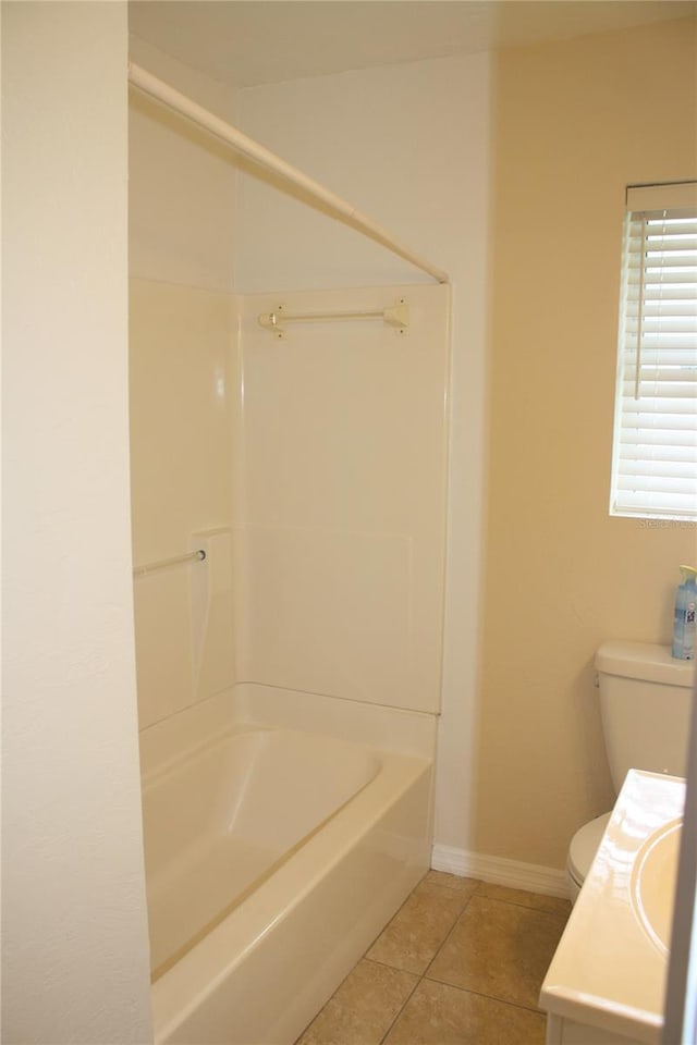 full bathroom featuring toilet, vanity, tile patterned floors, and shower / bathing tub combination