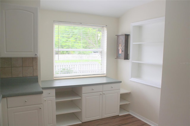 interior space with electric panel and dark hardwood / wood-style floors