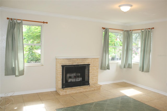 unfurnished living room featuring light tile patterned flooring, crown molding, and a wealth of natural light