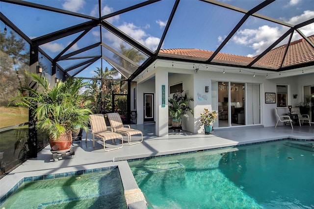 back of property featuring a patio and a lanai