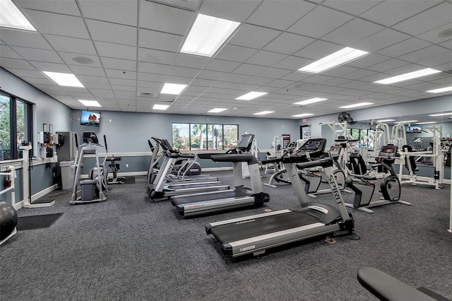 gym featuring a wealth of natural light and a paneled ceiling