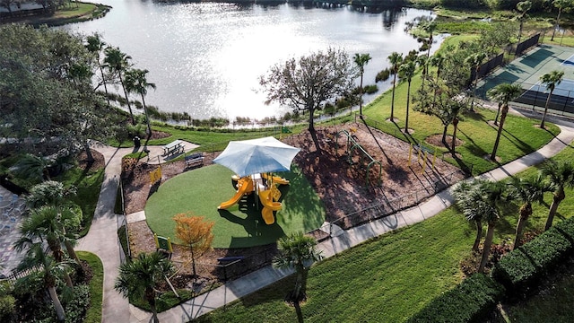 birds eye view of property with a water view