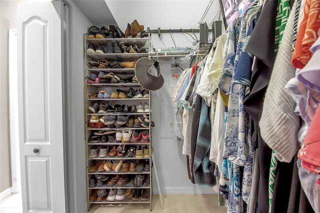 walk in closet with light tile patterned flooring