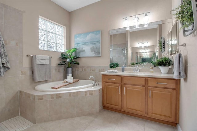 bathroom with vanity, tile patterned flooring, and independent shower and bath