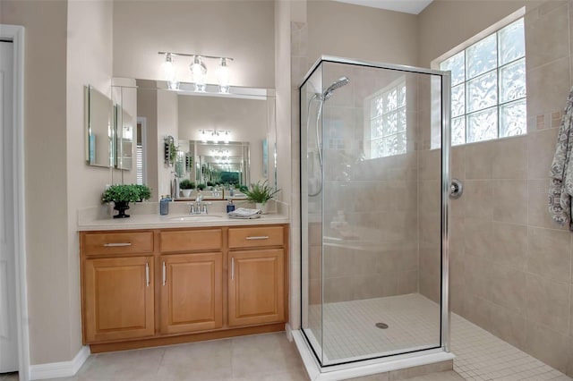 bathroom featuring tile patterned floors, vanity, and an enclosed shower