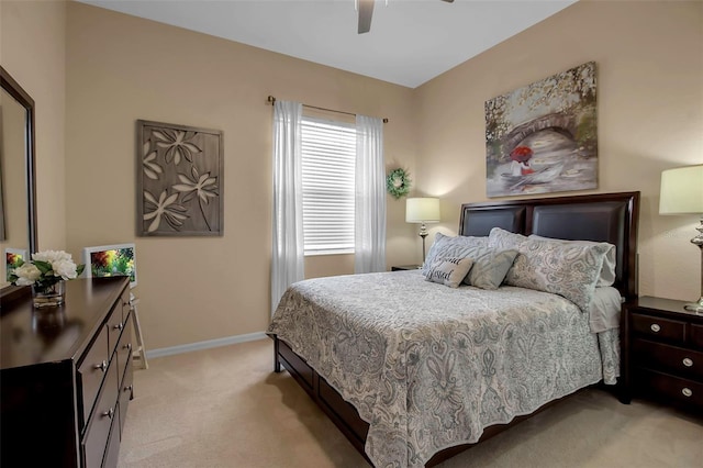 bedroom with light colored carpet and ceiling fan