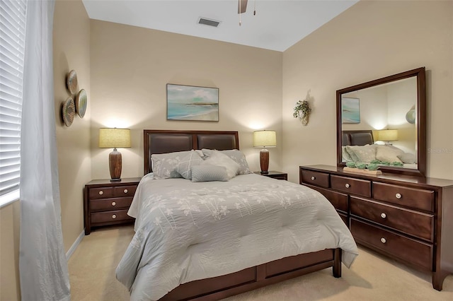 bedroom featuring light carpet