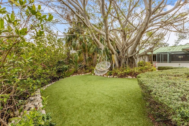 view of yard with a lanai