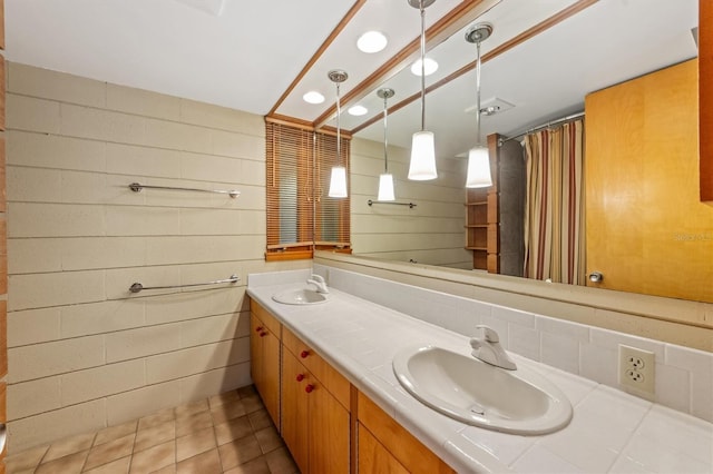 bathroom with tile patterned flooring and vanity