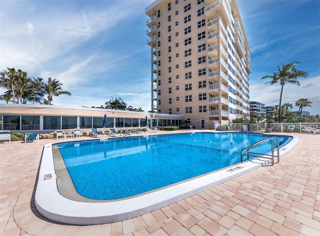 view of swimming pool with a patio area