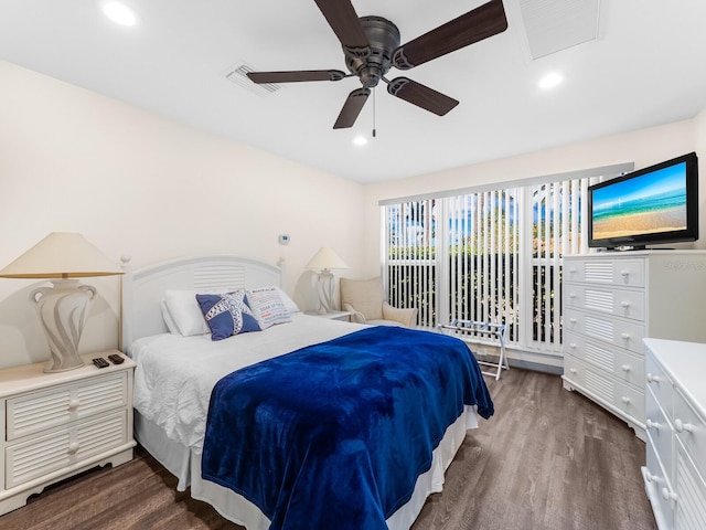 bedroom with ceiling fan and dark wood-type flooring