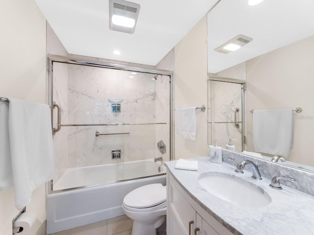 full bathroom with tile patterned floors, vanity, toilet, and combined bath / shower with glass door