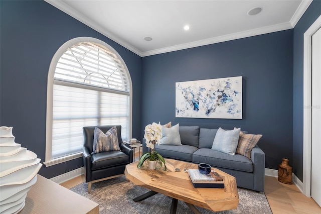 living room featuring wood-type flooring, a wealth of natural light, and crown molding