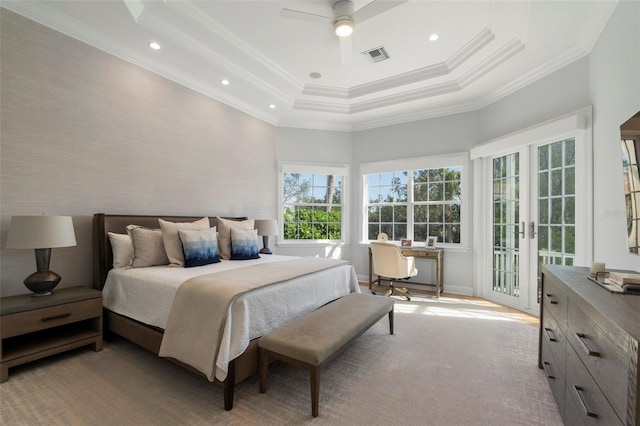 bedroom with access to exterior, a tray ceiling, ceiling fan, and ornamental molding