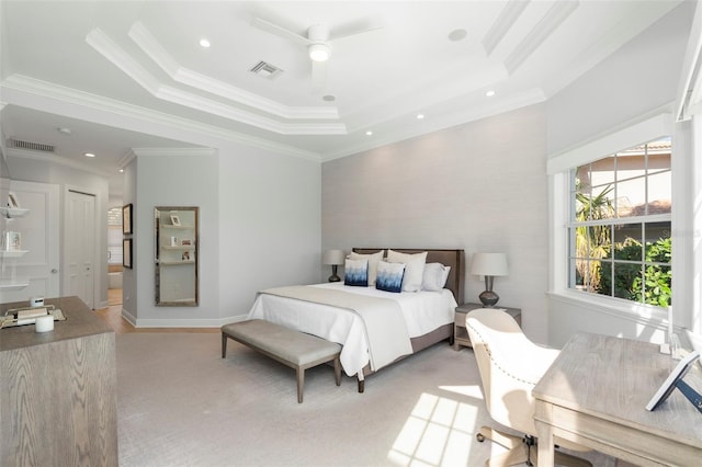 bedroom featuring ceiling fan, crown molding, and a tray ceiling