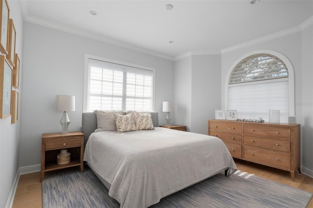 bedroom with wood-type flooring and crown molding