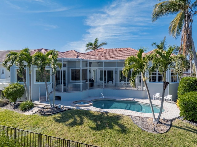 view of swimming pool with a lawn, an in ground hot tub, and a patio