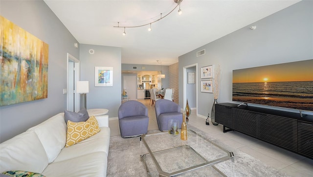 living room with light tile patterned floors