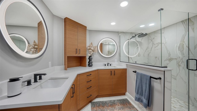 bathroom featuring an enclosed shower, vanity, and tile patterned flooring