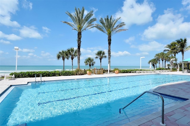 view of pool featuring a water view