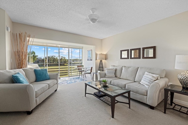 carpeted living room featuring a textured ceiling