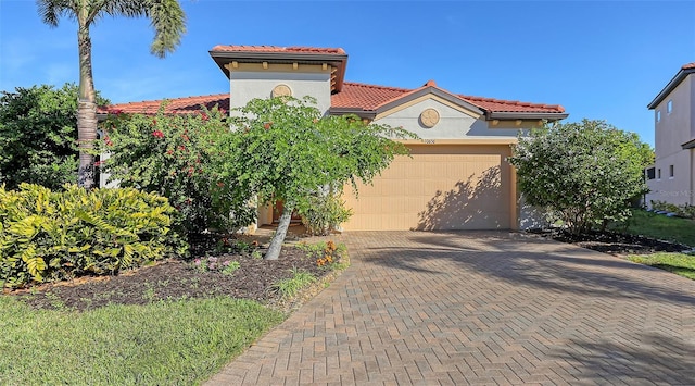 mediterranean / spanish-style house featuring a garage