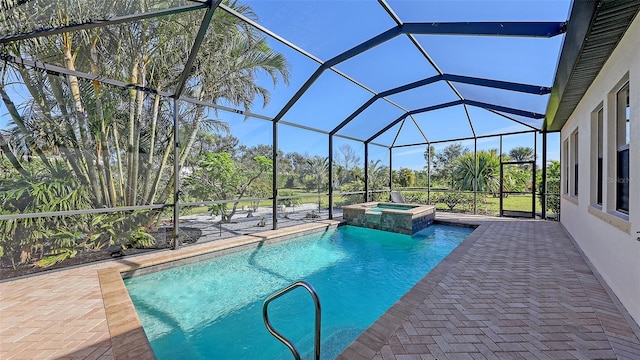 view of pool with a patio area, a lanai, and an in ground hot tub