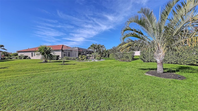 view of yard featuring a lanai